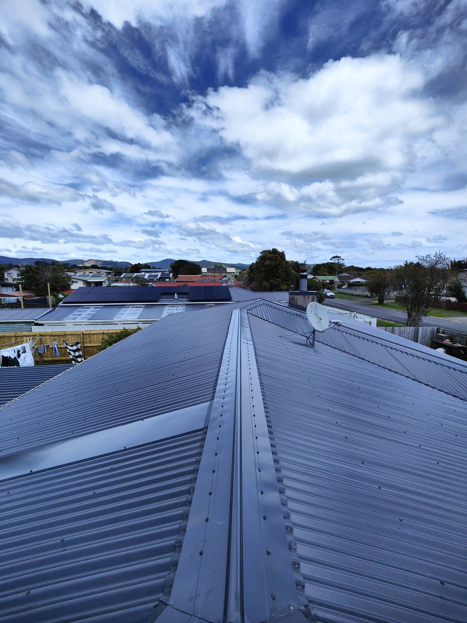 Weathered corrugated roof before replacement
