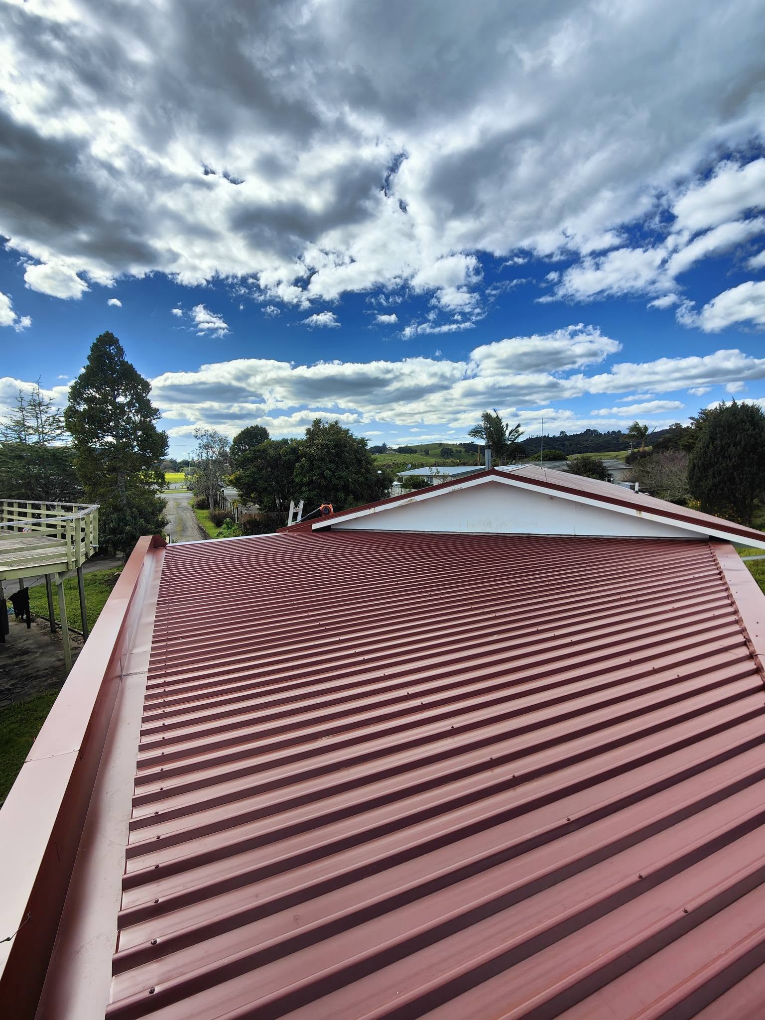 Simple new corrugated roof against blue sky