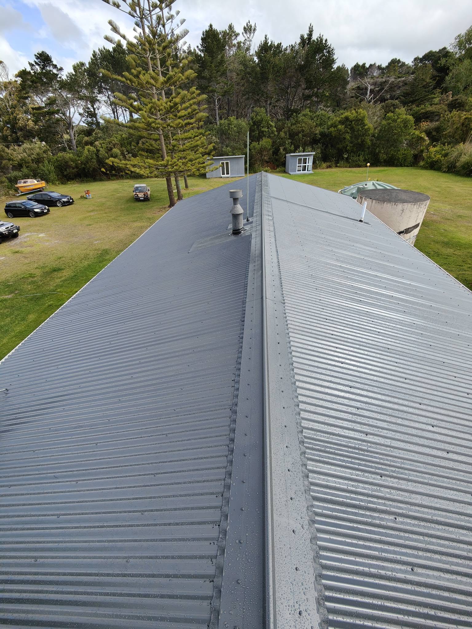 Simple new corrugated roof against blue sky