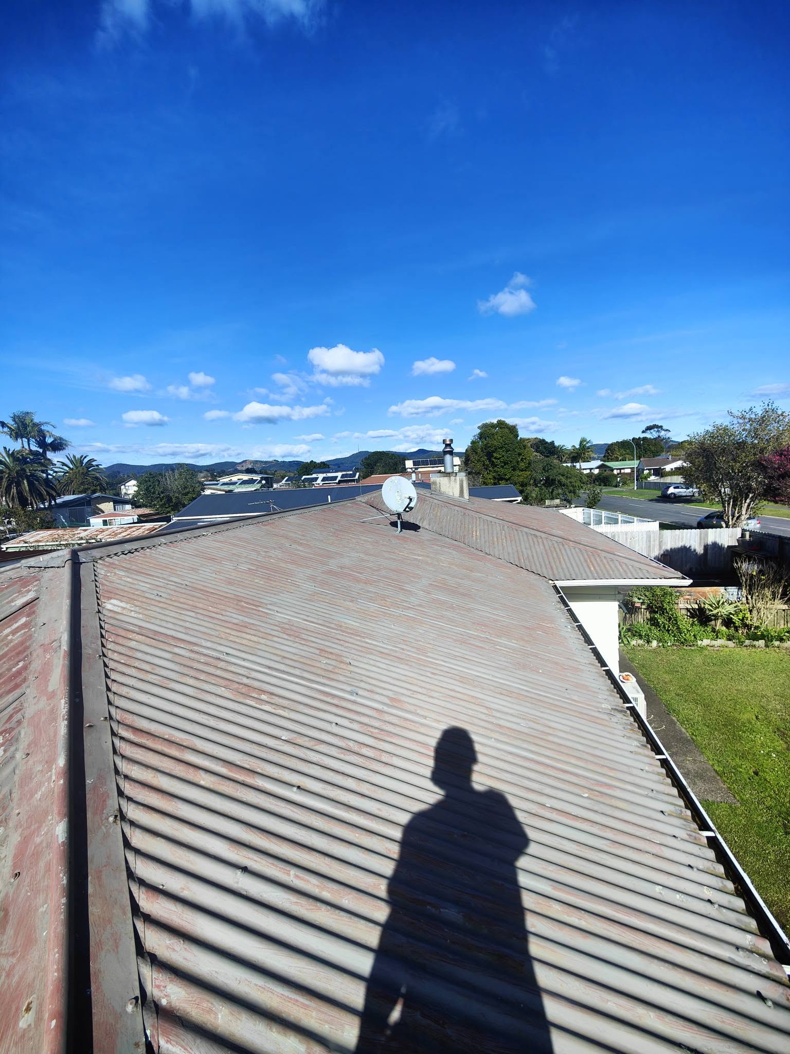 Weathered corrugated roof before replacement